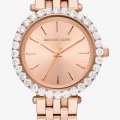 Montre féminine Michael Kors ton or rose avec lunette pavée